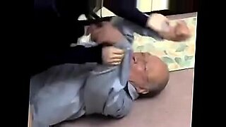 Elderly Japanese man engages in explicit sexual activity.