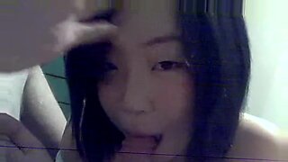 Seductive Asian amateur girlfriend expertly pleasures her partner with oral skills.